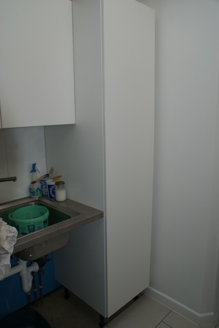 Utility cupboard complete and fitted flush to the wall
