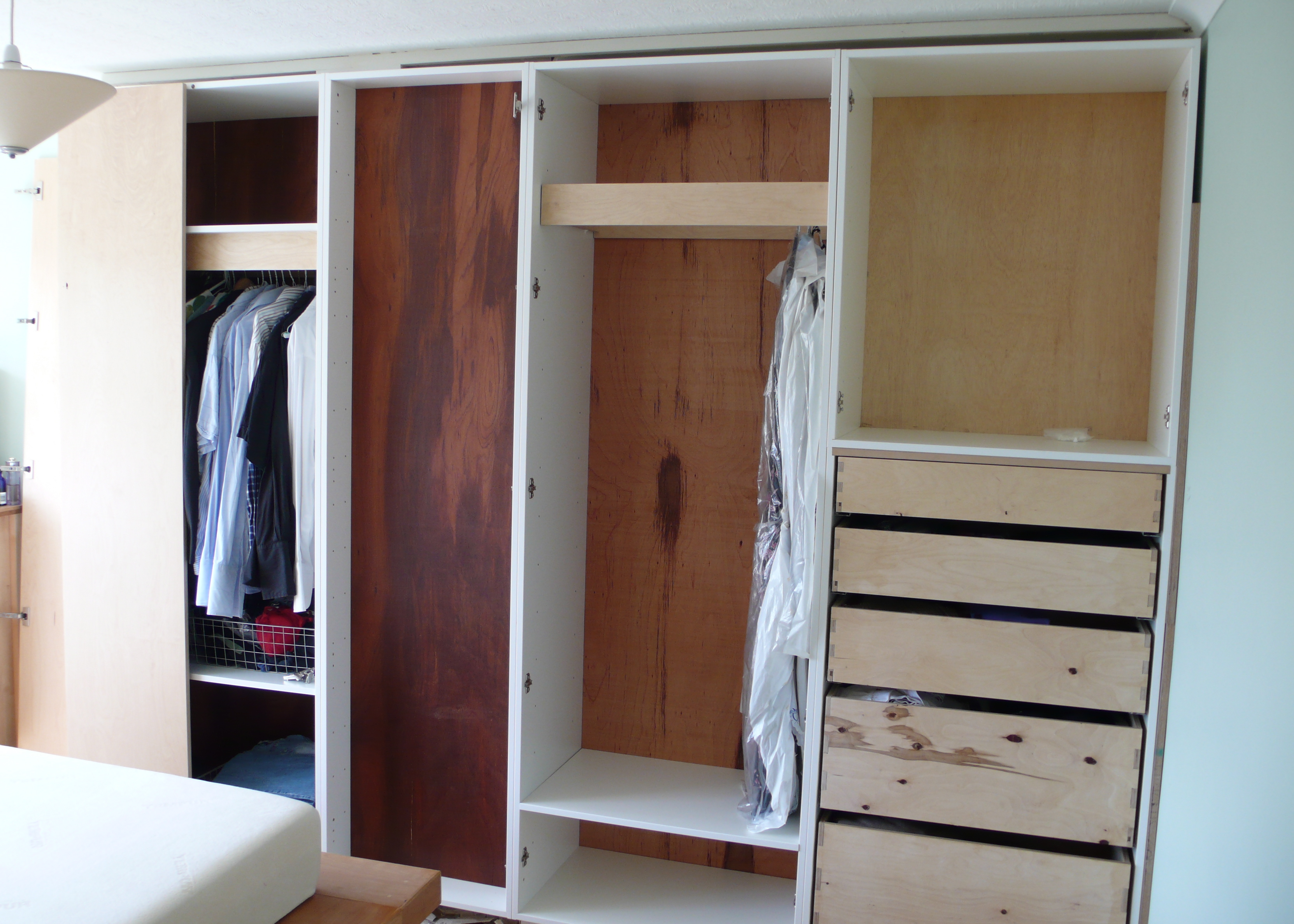 A shallow wardrobe (150mm deep) covers the chimney breast